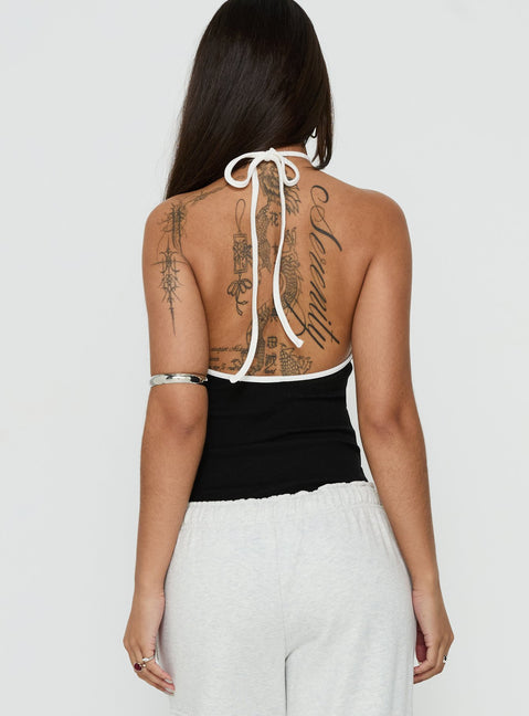 Designed with a sleeveless cut, the Azara Contrast Arrowneck Bodysuit Black / White womens-bodysuit back view of model wearing Princess Polly