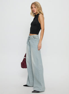 side view of model wearing Princess Polly Paltrow Mid Rise Wide Leg Cargo Jeans Faded Blue Wash Mid Rise Jeans 