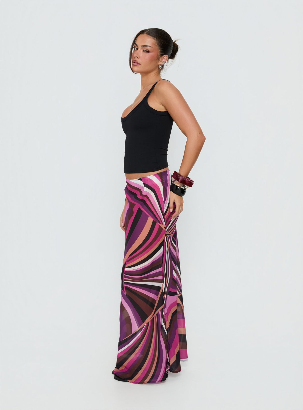 Introducing the Lucidia Maxi Skirt Pink Retro in womens-skirts featuring maxi length side view of model wearing Princess Polly