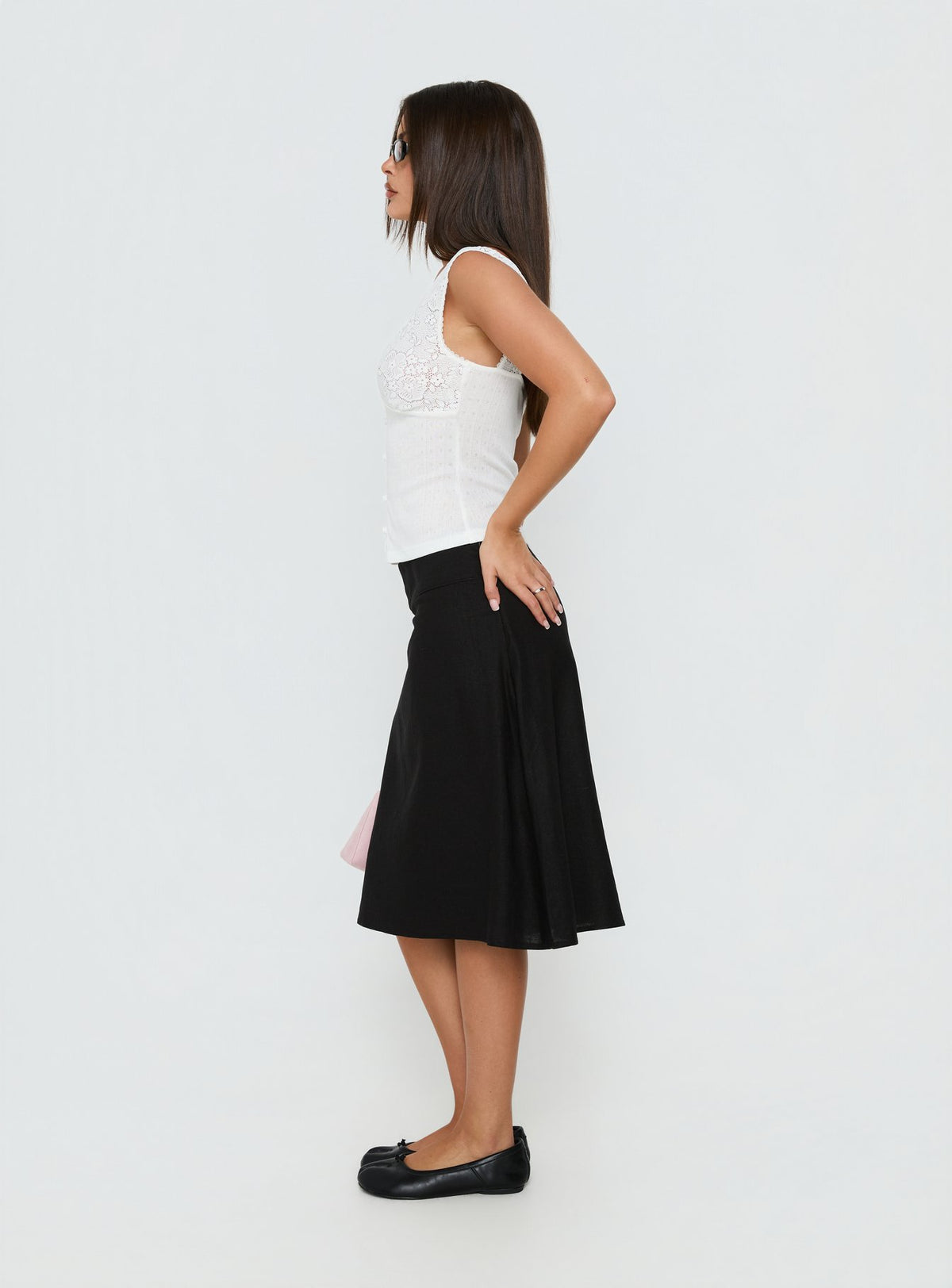 Presenting the Such Delight Linen Midi Skirt Black womens-skirts with relaxed aline silhouette side view of model wearing