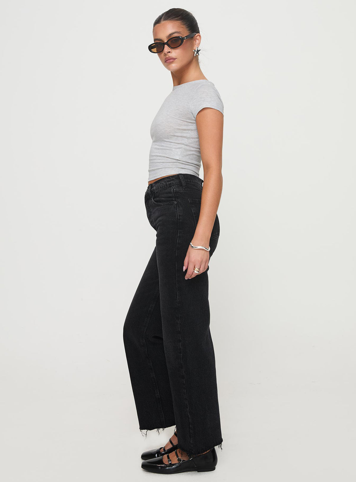 side view of model wearing Princess Polly Fawcett High Rise Straight Leg Jeans Washed Black High Rise Jeans 