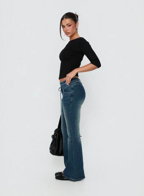 Designed with Runa Low Rise Tie Side Jeans Mid Blue Wash in womens-jeans featuring flared wide-leg cut side view of model wearing Princess Polly