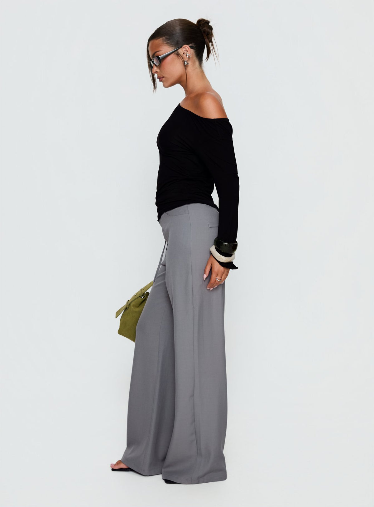 side view of model wearing Princess Polly Ikana Tie Side Pants Grey Mid Rise Pants 