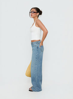 Designed with the Darla Low Rise Straight Leg Jean in Vintage Light Blue as womens jeans with low-rise side view of model wearing Princess Polly
