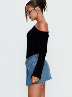   side view of model wearing Princess Polly Debera Pleated Mini Skirt Mid Blue Wash 