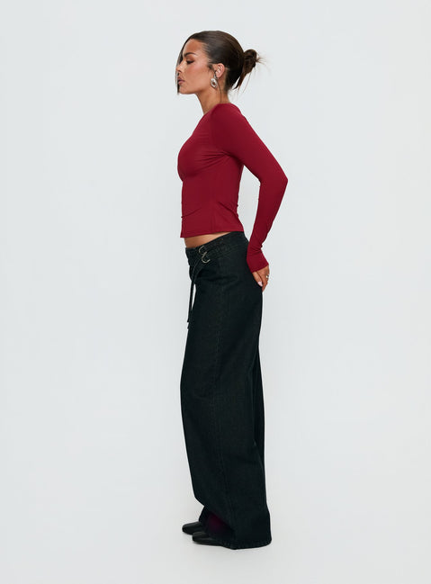side view of model wearing Princess Polly Boxie Mid Rise Wide Leg Jeans Washed Black Mid Rise Jeans 