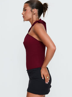 side view of model wearing Princess Polly Bridey Cut Out Bodysuit Red Sleeveless 