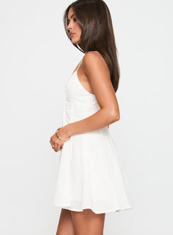 side view of model wearing Princess Polly Libertie Pleat Mini Dress White V-Neck 