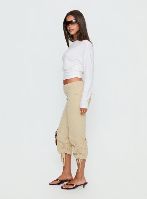 side view of model wearing Princess Polly Hot Rod Capri Pant Beige Mid Rise Pants 