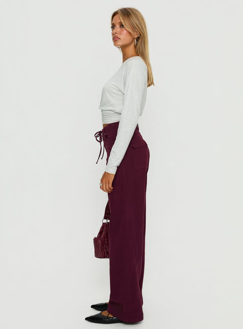 side view of model wearing Princess Polly Bruiser Tie Waist Mid Rise Wide Leg Jeans Currant High Rise Jeans 