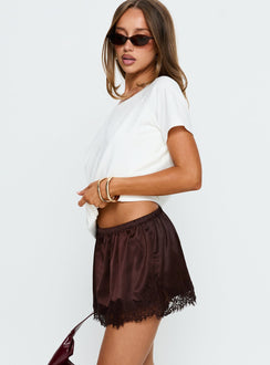   side view of model wearing Princess Polly Orlynn Satin Lace Trim Mini Skirt Brown Mini Skirts 