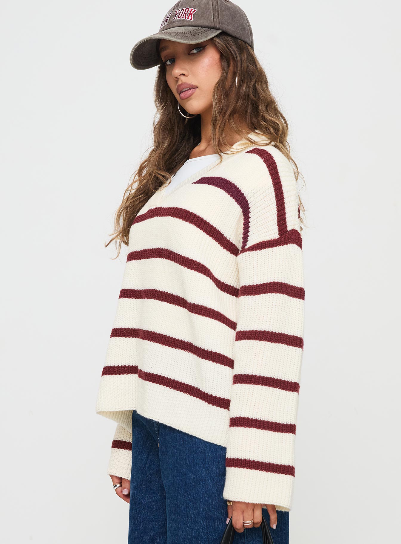side view of model wearing Princess Polly Forte Knit Sweater Red / Cream Longline Jumpers Jumpers 