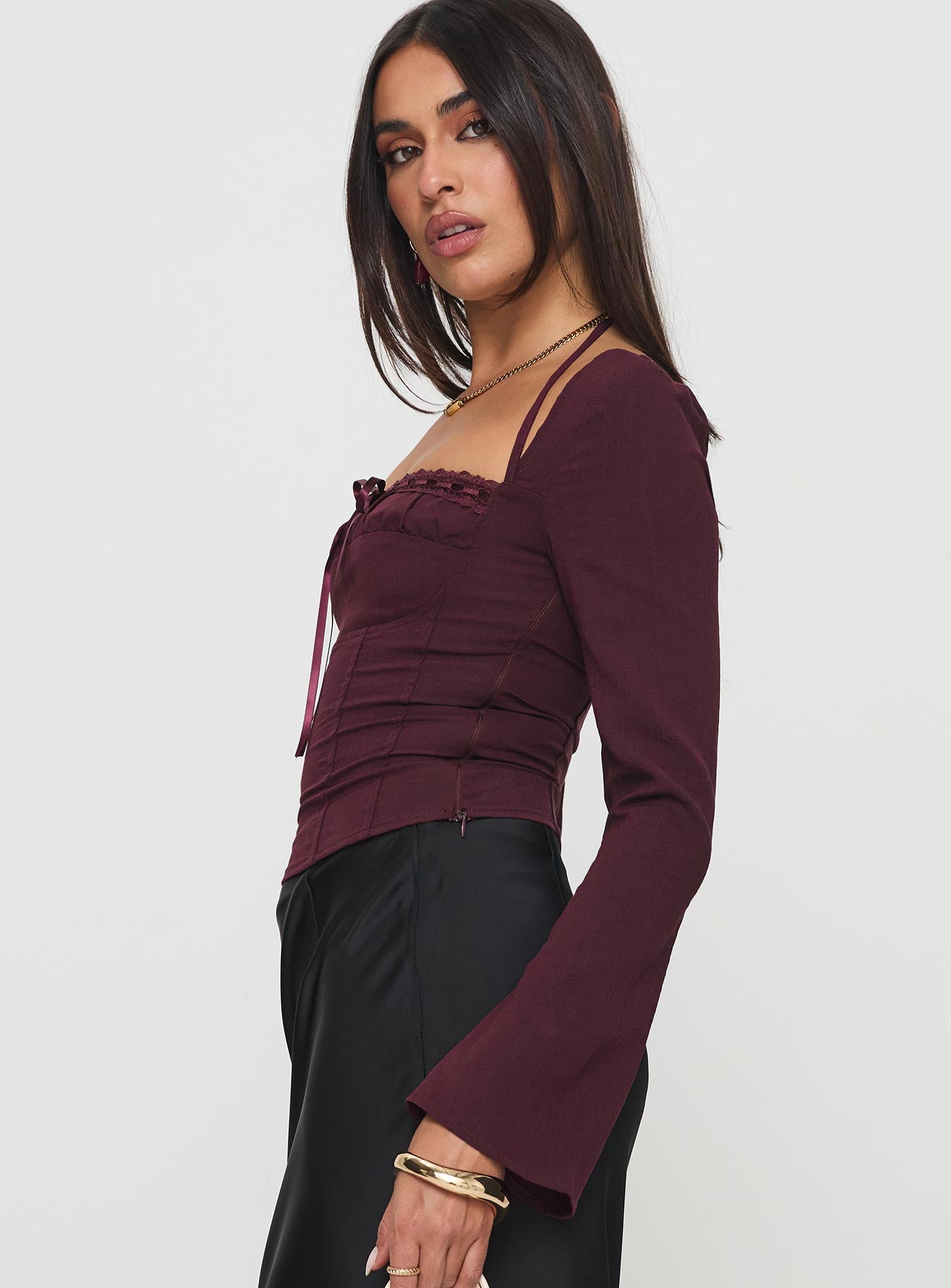 side view of model wearing Princess Polly Trynia Long Sleeve Top Burgundy Full Sleeves Square Neck 