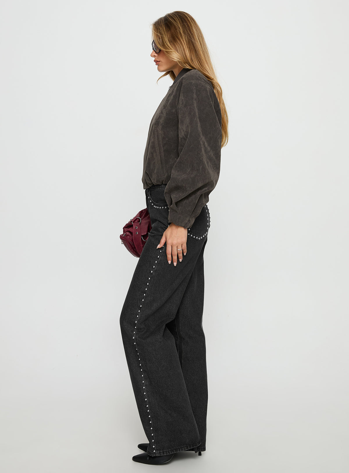 side view of model wearing Princess Polly Saving Up Stud Detail Jeans Jet Black High Rise Jeans 