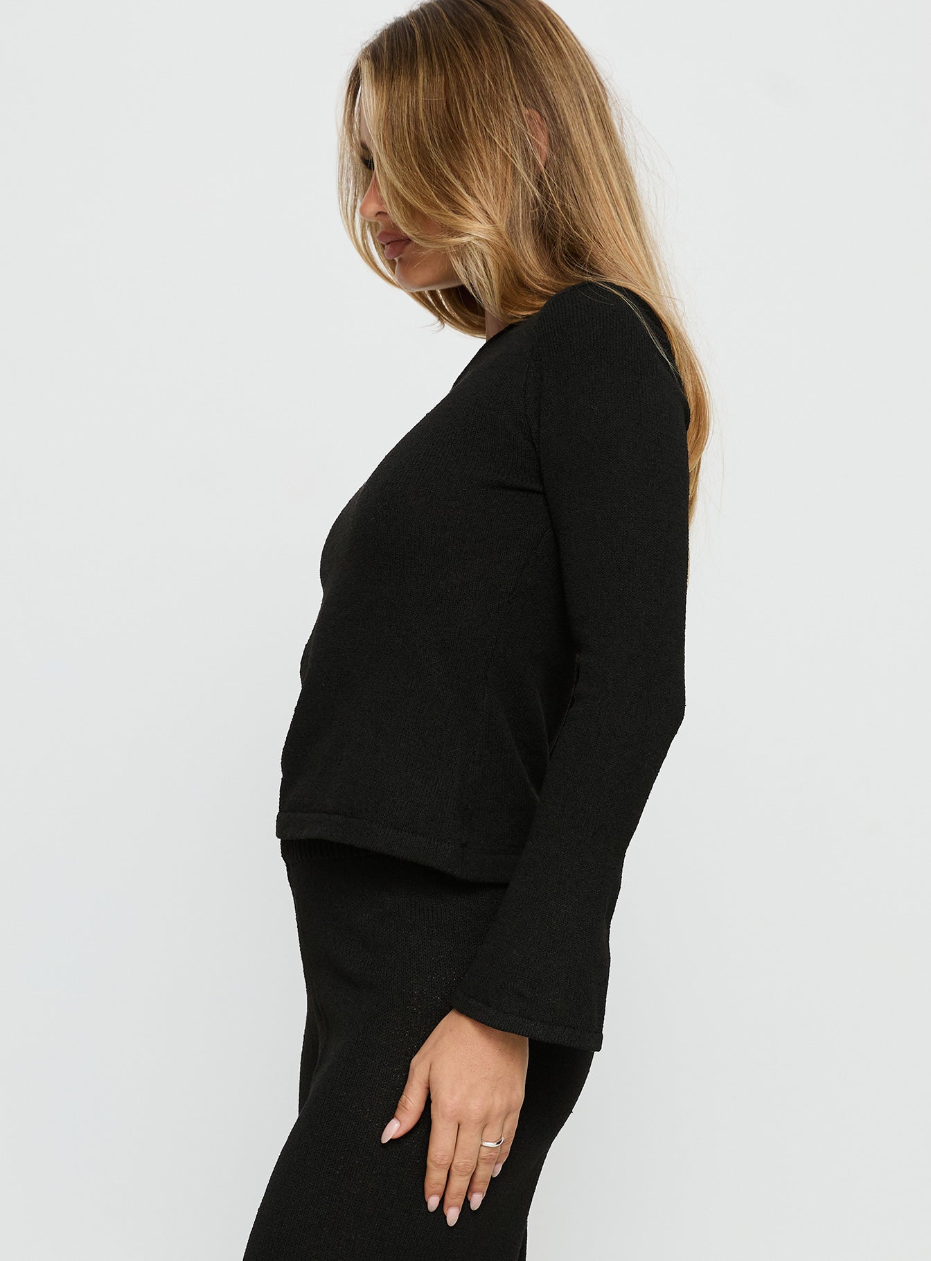 side view of model wearing Princess Polly Jaede Off Shoulder Knit Sweater Black Cropped Jumpers 