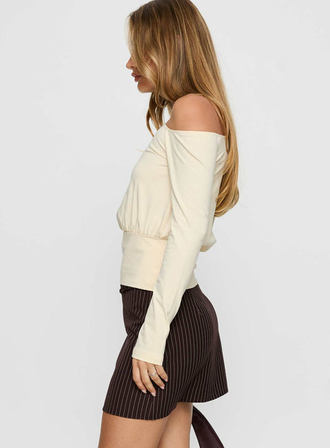   side view of model wearing Princess Polly Yellena Buckle Mini Skirt Brown Pinstripe Mini Skirts Skirts 