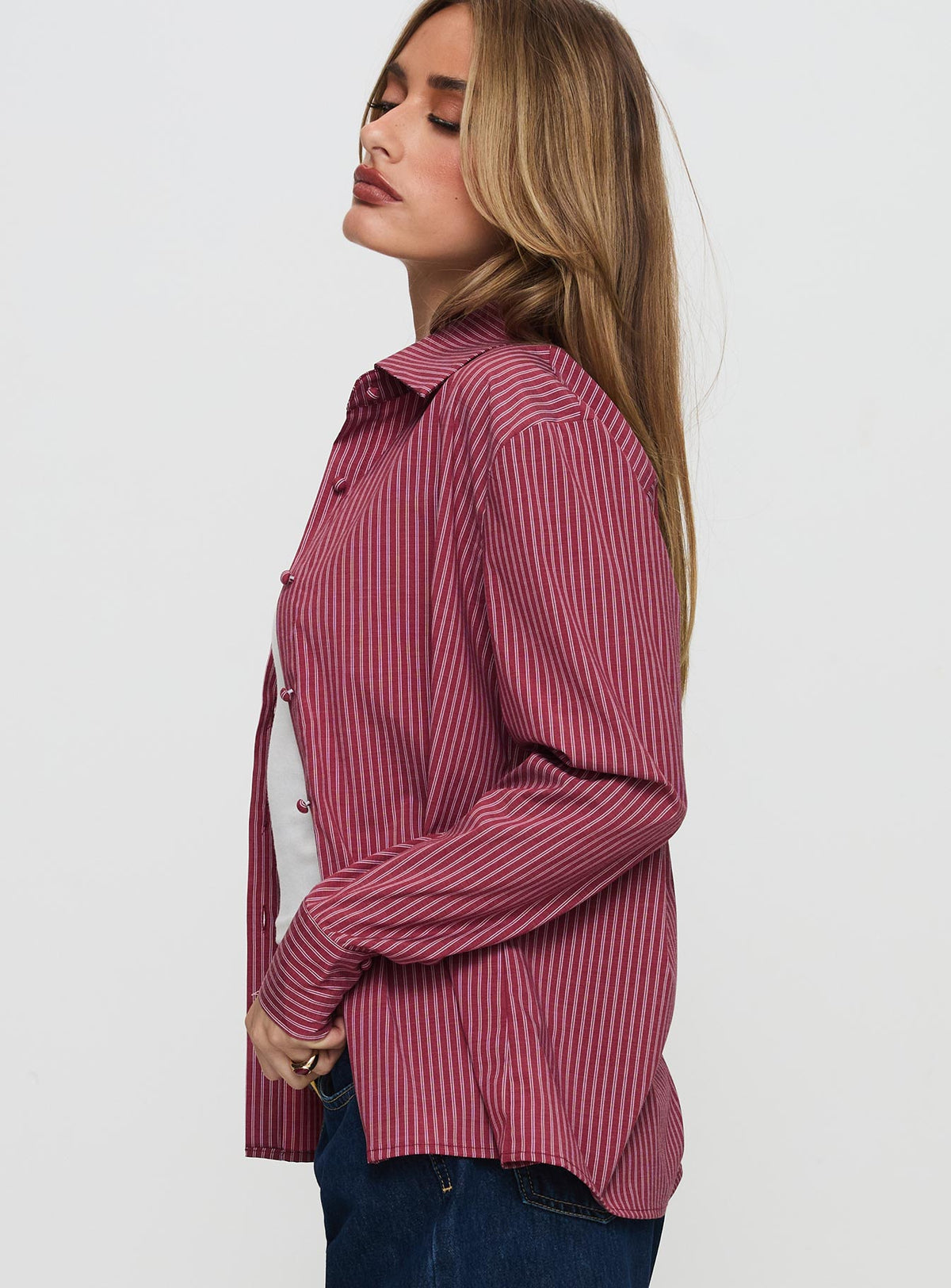 side view of model wearing Princess Polly Mandisa Long Sleeve Top Red Stripe Full Sleeves Crew Neck 