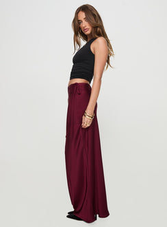   side view of model wearing Princess Polly Fluttering Maxi Skirt Burgundy Maxi Skirts Skirts 