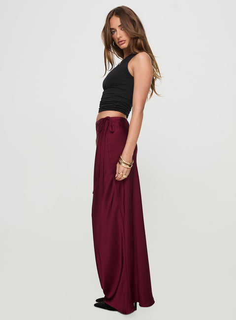  side view of model wearing Princess Polly Fluttering Maxi Skirt Burgundy Maxi Skirts Skirts 