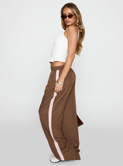 side view of model wearing Princess Polly No Doubts Track Pant Brown High Waisted Pants 