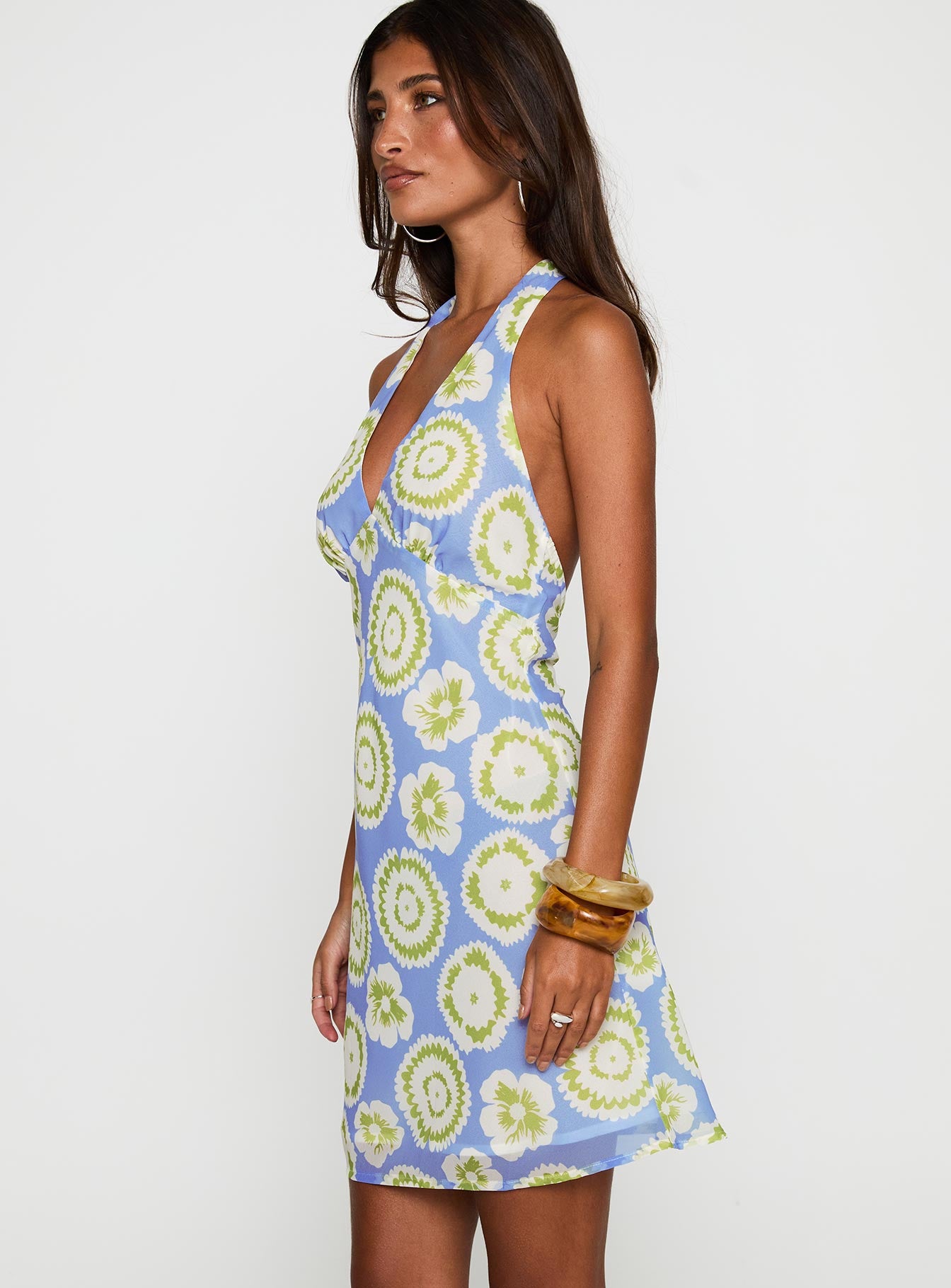 side view of model wearing Princess Polly Neelia Mini Dress Blue / Yellow Plunger 