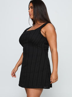side view of model wearing Princess Polly Dasha Mini Dress Black Curve Square Neck 
