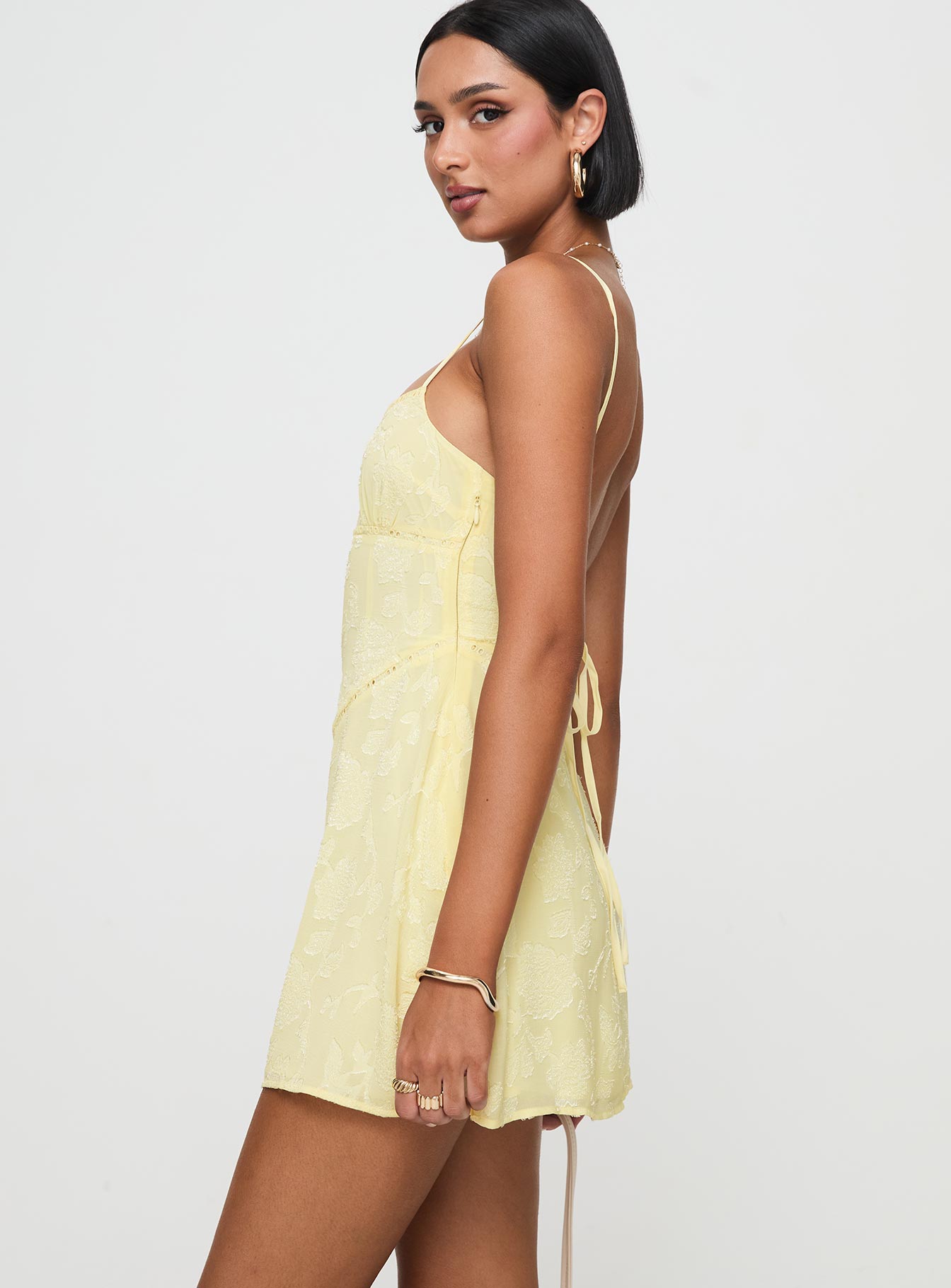 side view of model wearing Princess Polly South Of France Mini Dress Yellow Petite Square Neck 