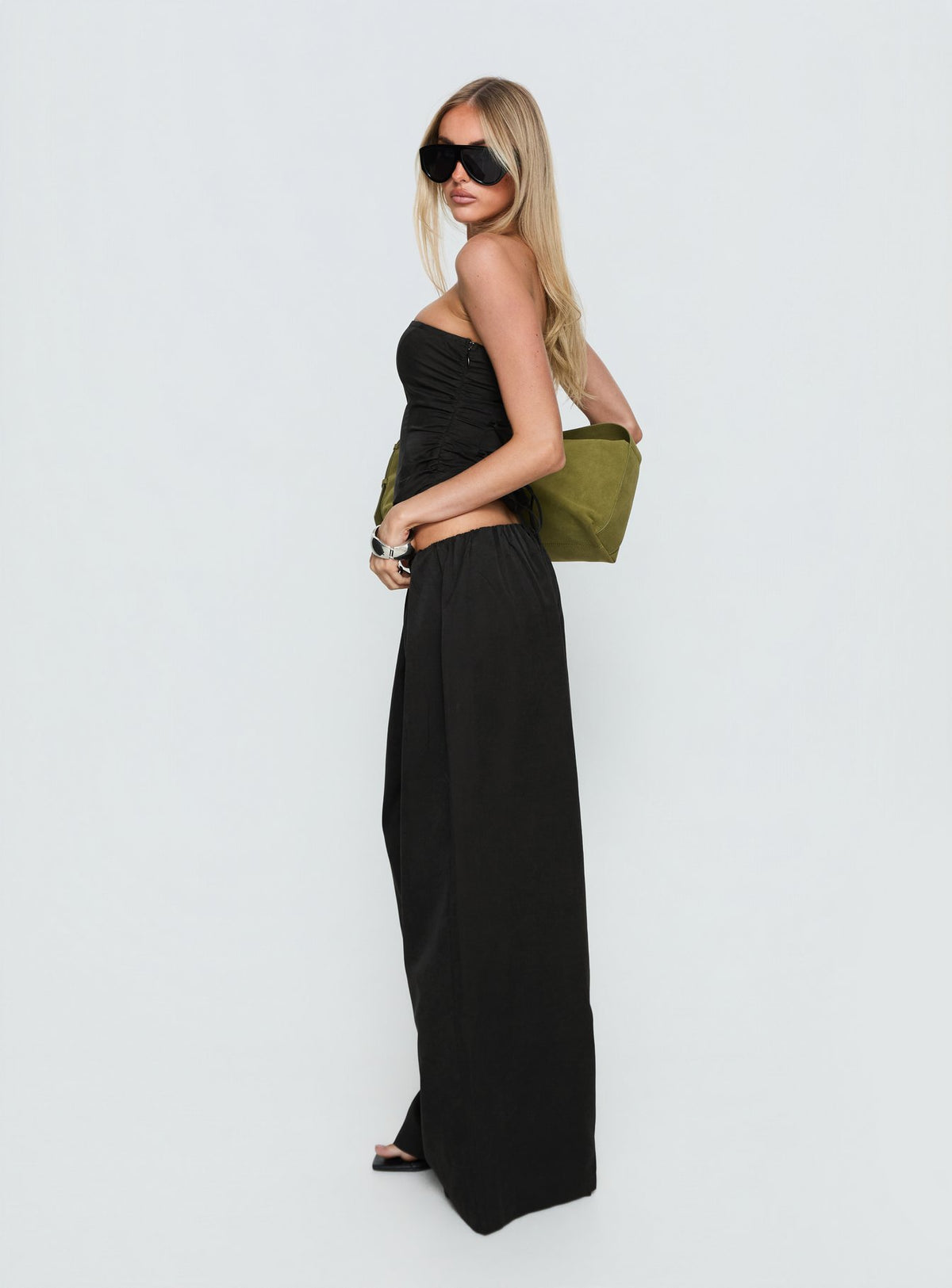 side view of model wearing Princess Polly Odara Wide Leg Pants Black Low Rise Pants 