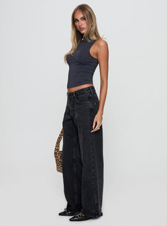 side view of model wearing Princess Polly Serenitia Mid Rise Relaxed Jeans Washed Black Petite Mid Rise 