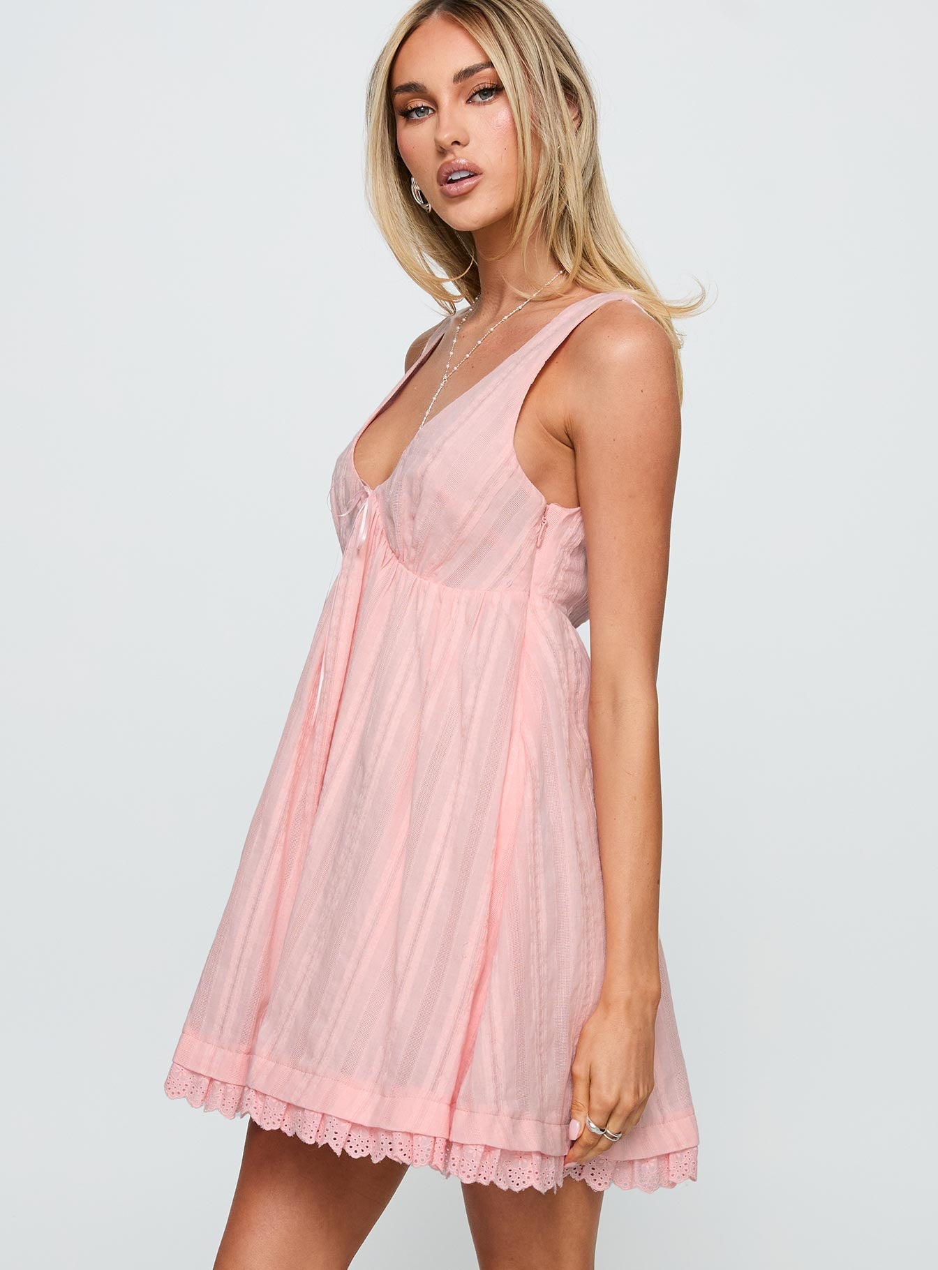 side view of model wearing Princess Polly Nelty Mini Dress Pink Plunger 