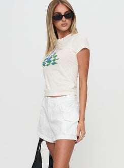 side view of model wearing Princess Polly Colonel Cargo Mini Short White Petite High Waisted Shorts 