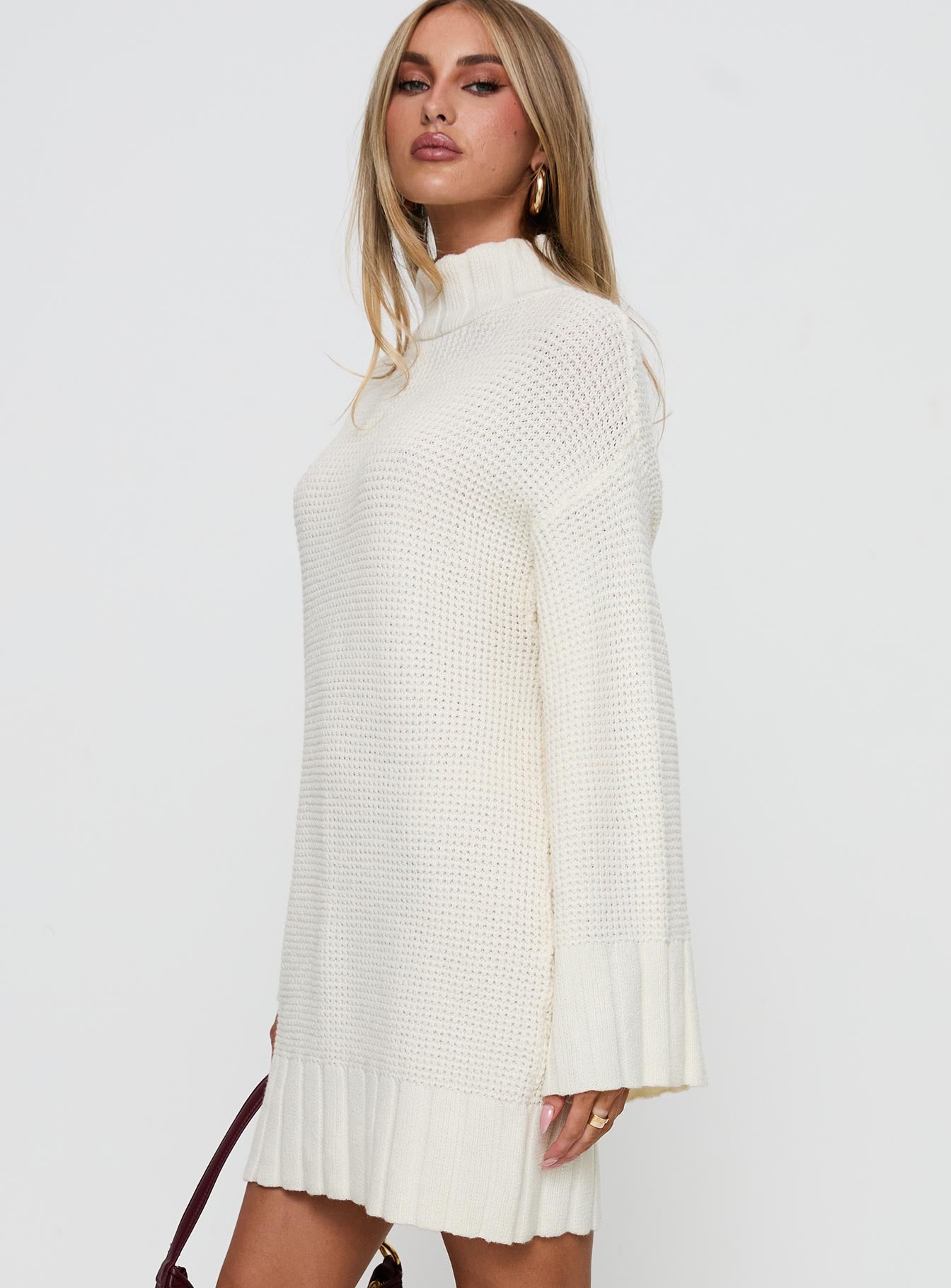 side view of model wearing Princess Polly Tarin Knit Mini Dress Cream High Neck 