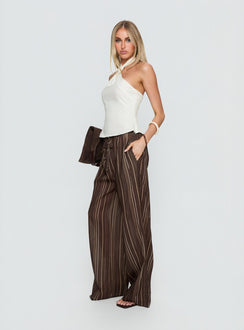 side view of model wearing Princess Polly Parklea Pants Brown Multi High Rise Pants 