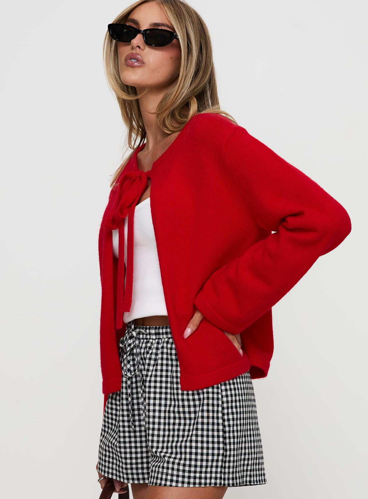 side view of model wearing Princess Polly Norine Tie Up Knit Sweater Red Cropped 