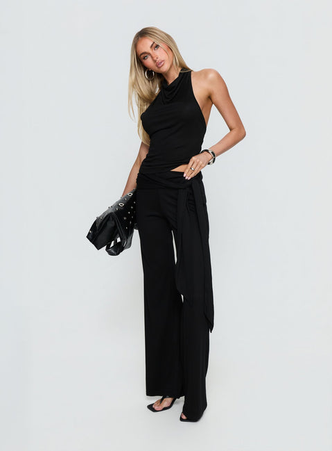 side view of model wearing Princess Polly Katiana Wrap Jersey Pants Black Mid Rise Pants 