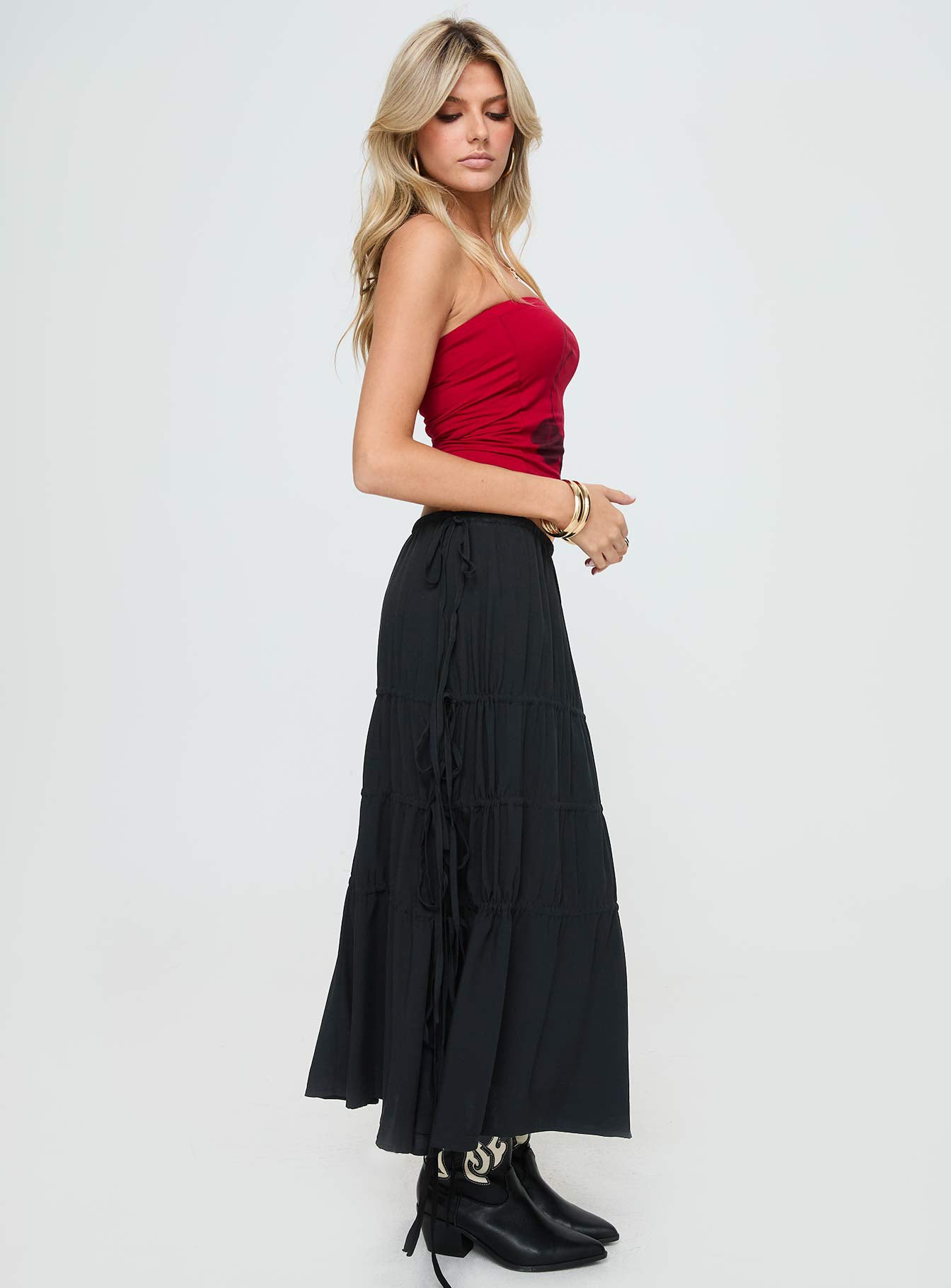   side view of model wearing Princess Polly Perky Maxi Skirt Black Maxi Skirts Skirts 