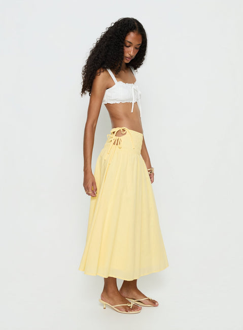   side view of model wearing Princess Polly Vence Ruched Maxi Skirt Lemon Yellow Maxi Skirts 