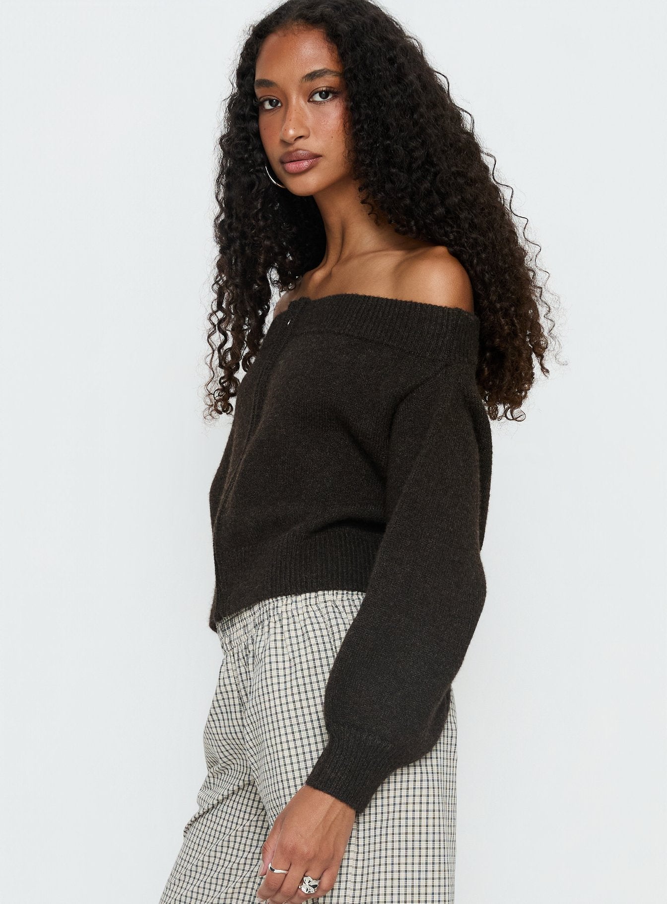 side view of model wearing Princess Polly Ortensa Off Shoulder Zip Through Jumper Brown 