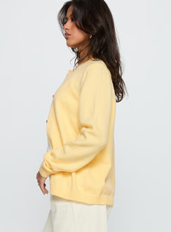 side view of model wearing Princess Polly Arica Button Up Knit Cardigan Lemon Longline Jumpers 