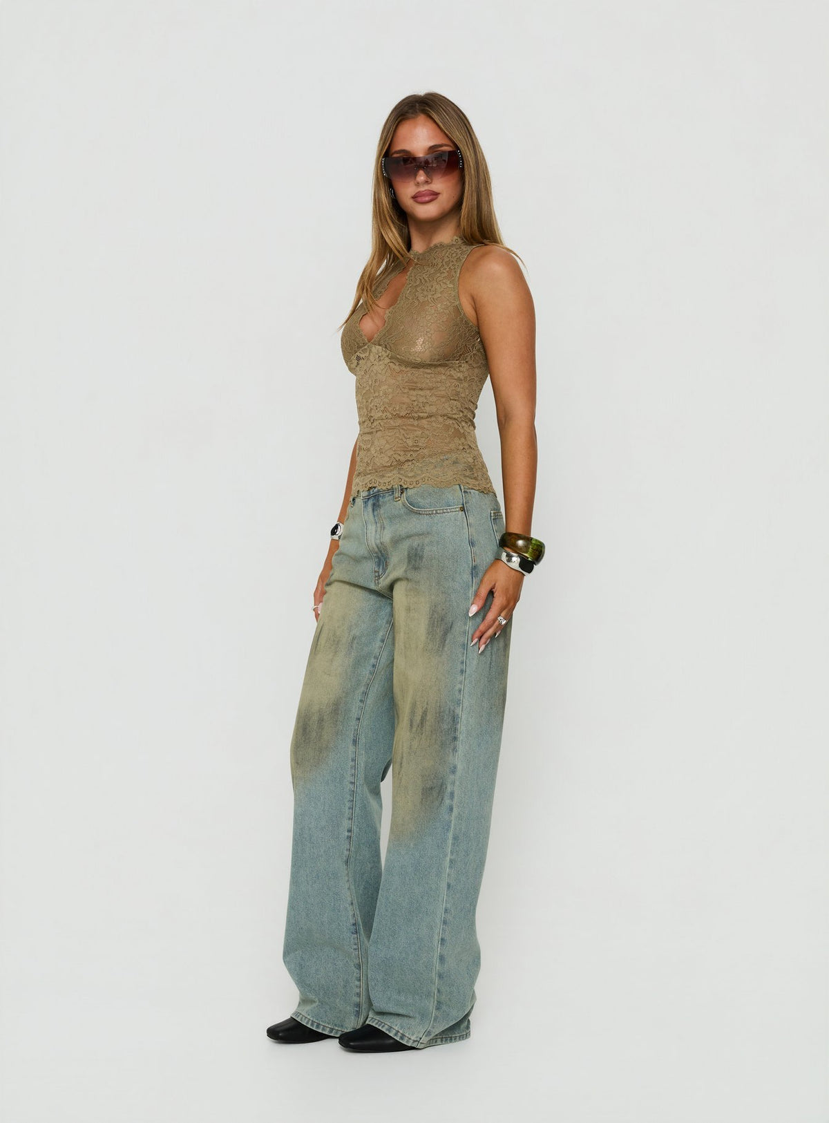 Featuring the Top Model Jean Stone Blue womens-jeans with high-rise design side view of model wearing Princess Polly