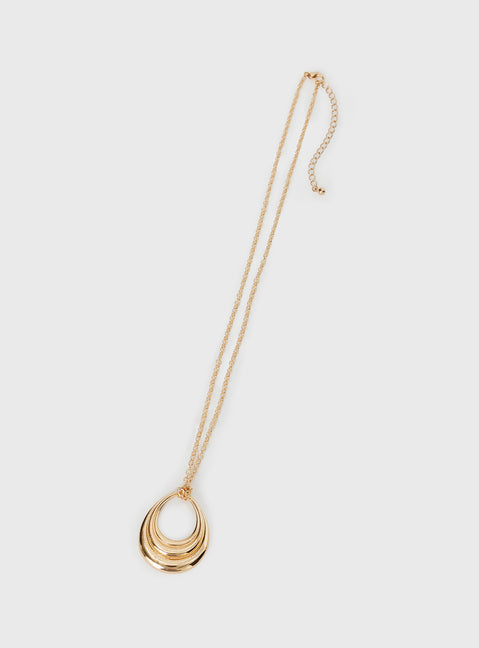 Gold toned pendant necklace