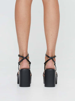 Heels Platform style, open toe, flared block heel Faux leather material, square open toe, thin upper straps Thin Ankle Strap with Adjustable Buckle Fastening