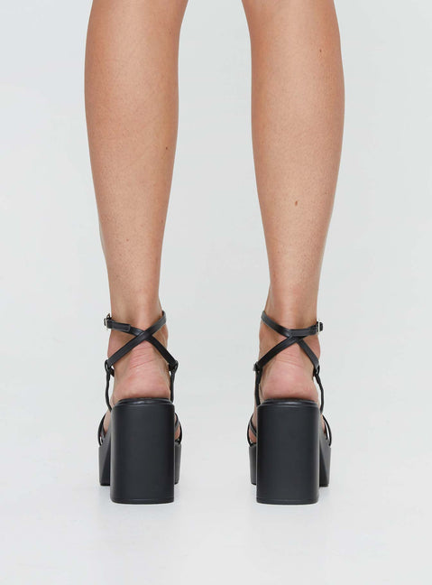 Heels Platform style, open toe, flared block heel Faux leather material, square open toe, thin upper straps Thin Ankle Strap with Adjustable Buckle Fastening