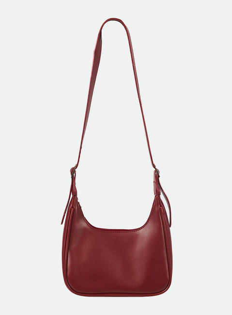 Shoulder bag Shoulder bag  Faux leather material  Adjustable shoulder strap  Gold-toned hardware   Zip fastening  Single internal zip pocket  Flat base 