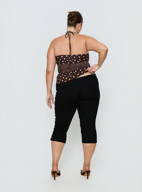 back view of model wearing Princess Polly Baseline Rib Capri Pants Black Curve Mid Rise Pants 