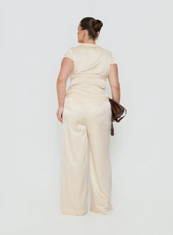 Explore the Aubrette Satin Tie Pants Cream Curve womens-regular-pants with high-rise fit, belt feature and wide-leg shape back view of model wearing Princess Polly
