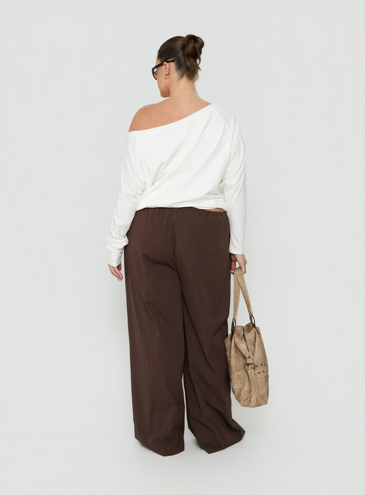 Presenting the Lunea Concealed Waistband Pants Brown Curve in womens regular pants with high-rise styling back view of model wearing Princess Polly