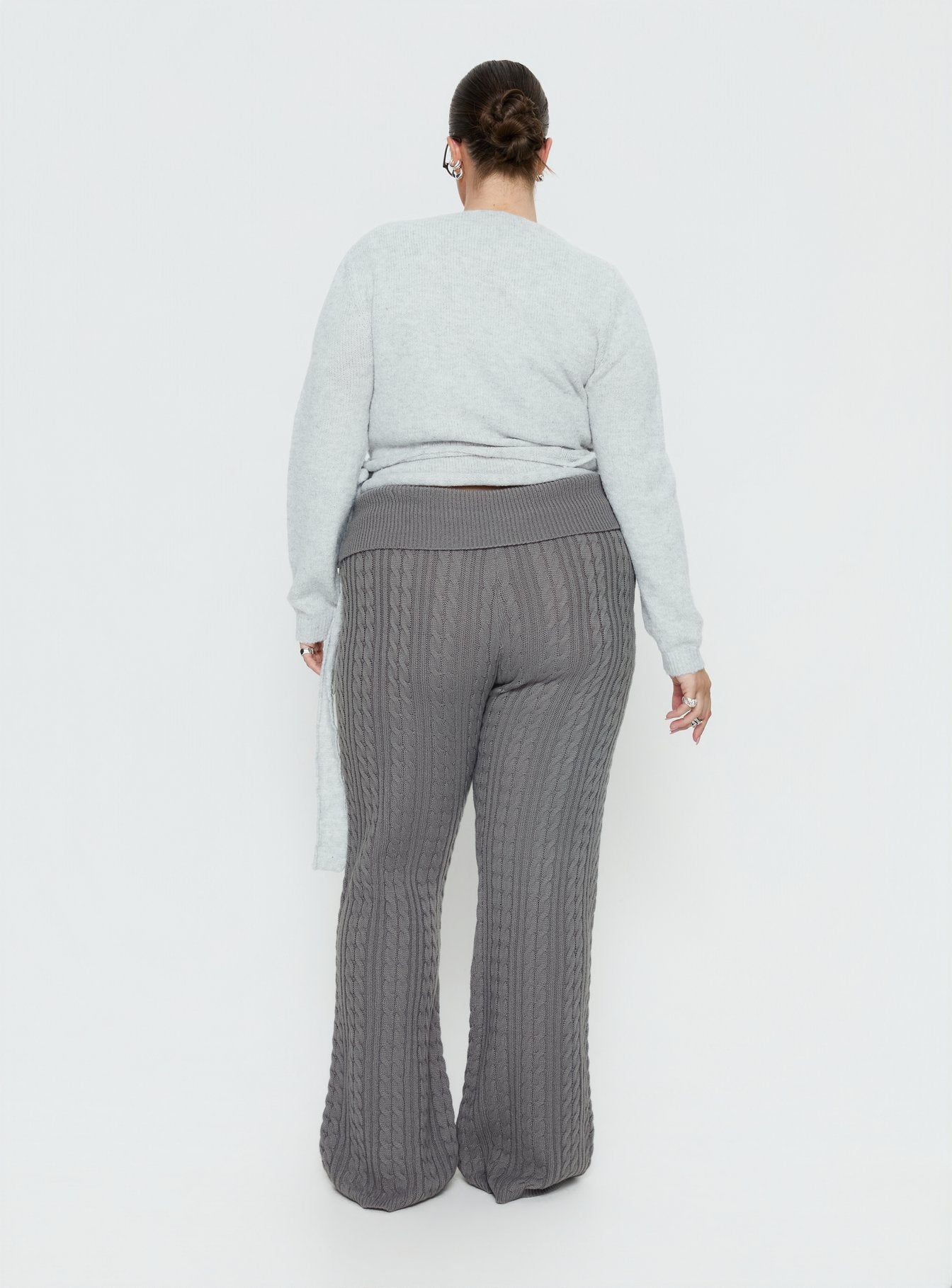 back view of model wearing Princess Polly Baleigh Cable Knit Foldover Pants Grey Curve High Rise Pants 