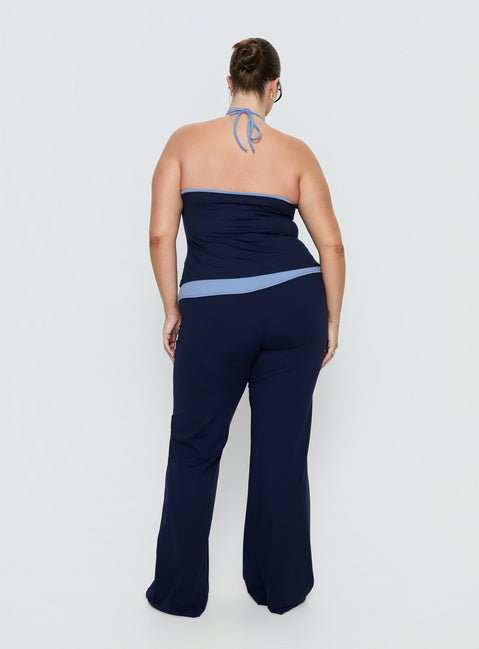 back view of model wearing Princess Polly Kobee Jersey Flare Pants Navy / Light Blue Curve High Rise Pants 