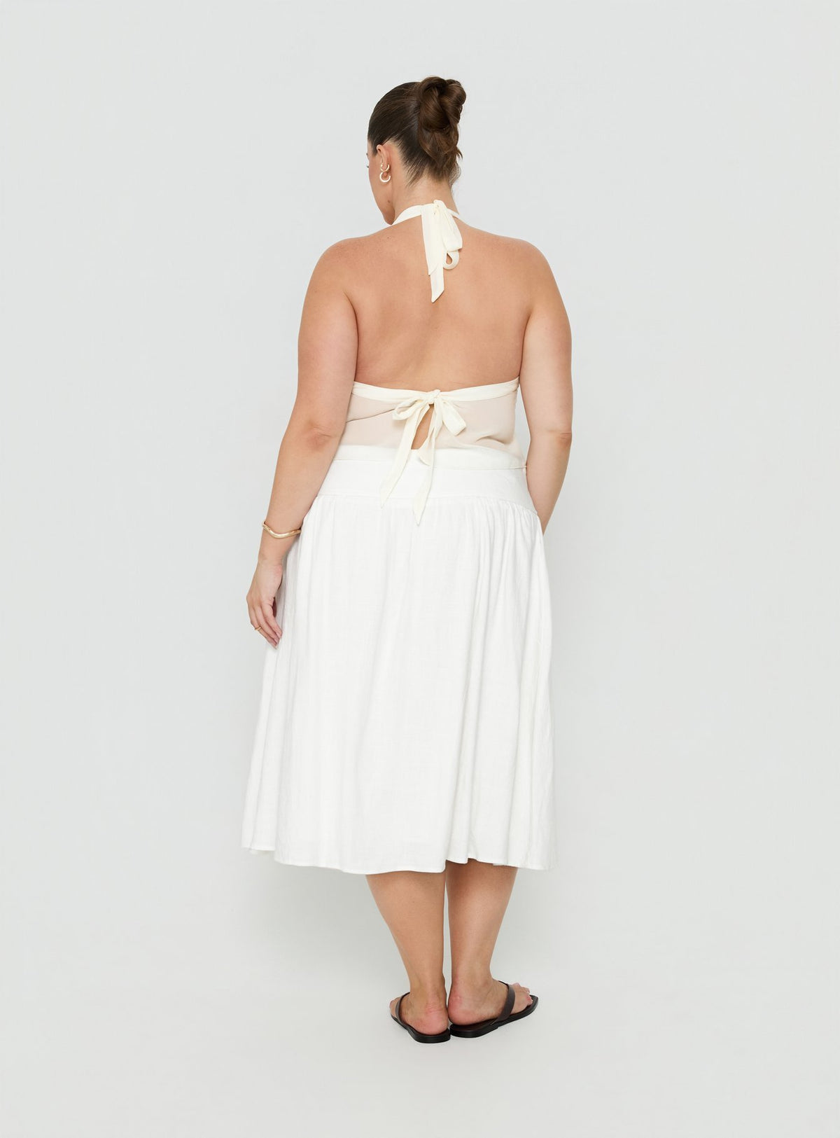Displaying the Heart Of Gold Linen Blend Midi Skirt White Curve in womens-skirts with midi length back view of model wearing Princess Polly